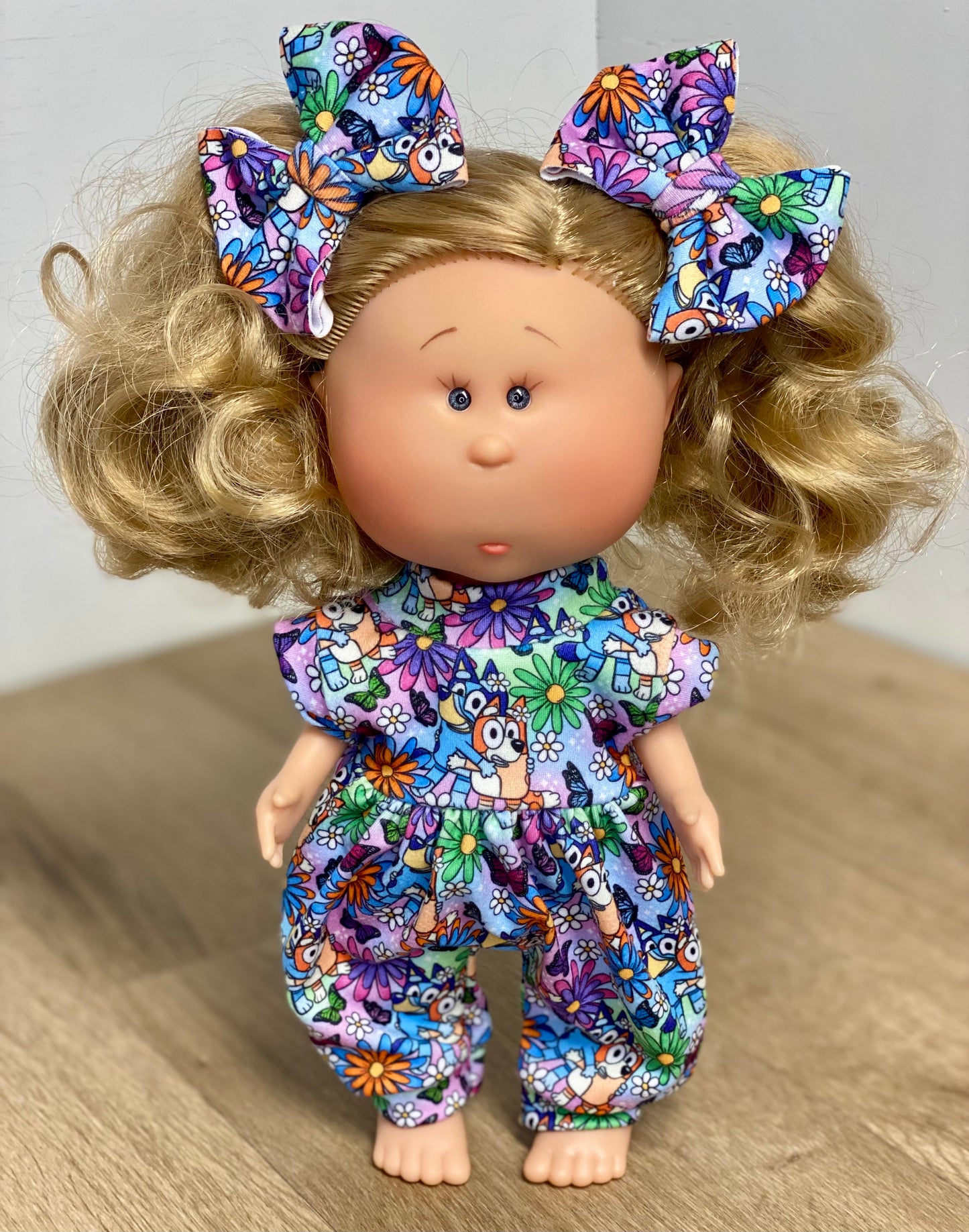 Mia Floral Blue and Orange Heelers Tank Sleeve Bubble Romper and 3” piggy Bow Set